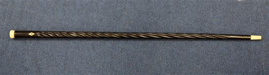 A late 19th / early 20th century ebony spiral twist turned walking cane, 37.25in.